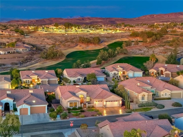 birds eye view of property with a mountain view