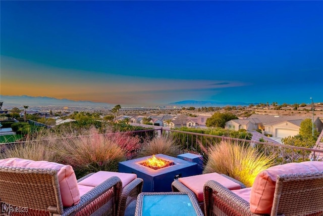 patio terrace at dusk with a fire pit