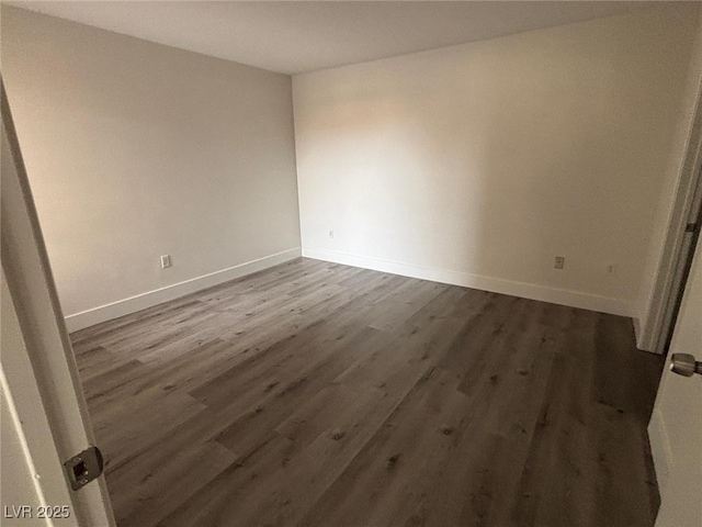 empty room featuring dark hardwood / wood-style floors