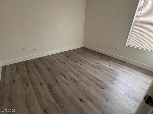 unfurnished room featuring hardwood / wood-style floors