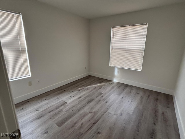 spare room featuring light hardwood / wood-style floors