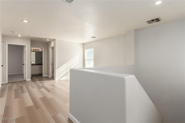 corridor featuring light hardwood / wood-style floors