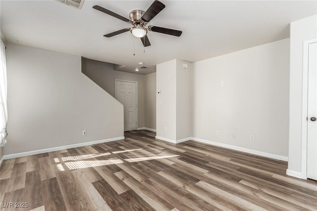 unfurnished living room featuring hardwood / wood-style floors and ceiling fan