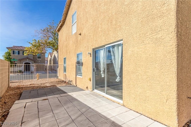 view of property exterior featuring a patio area