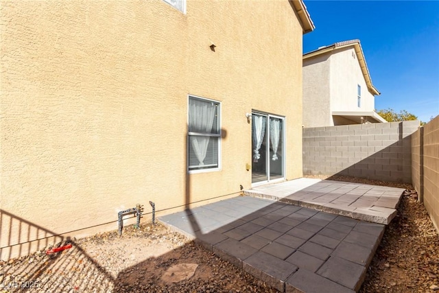 rear view of property featuring a patio