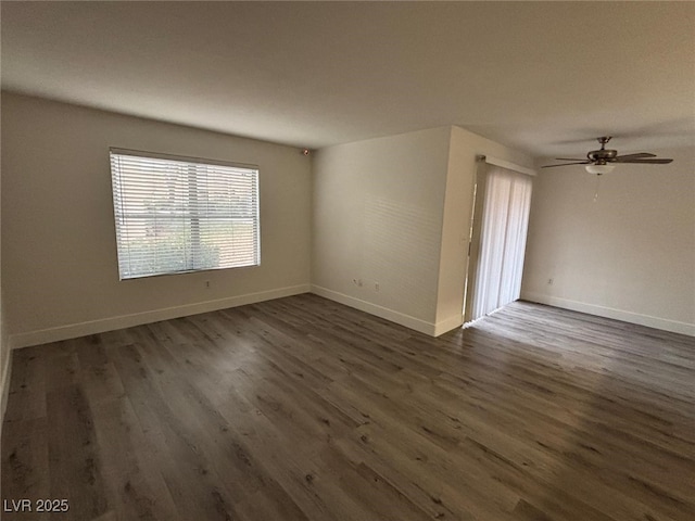 spare room featuring dark hardwood / wood-style floors and ceiling fan