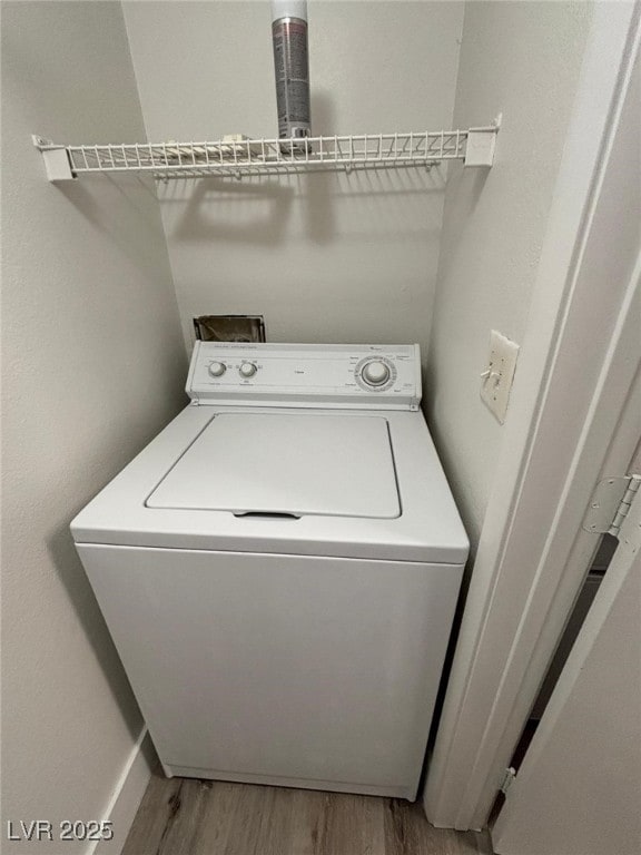 washroom with light wood-type flooring and washer / clothes dryer