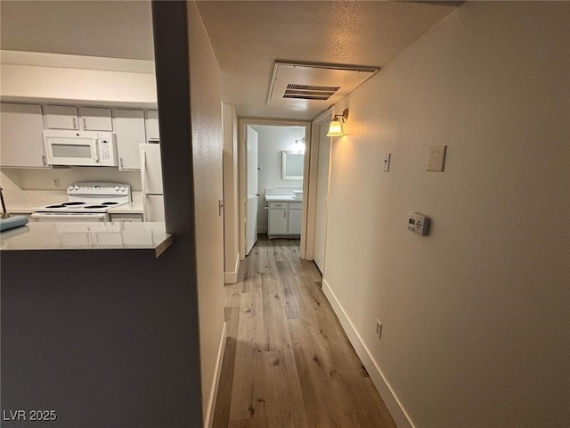 hall featuring light hardwood / wood-style floors