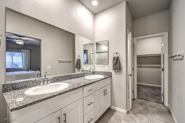 bathroom with vanity and ceiling fan