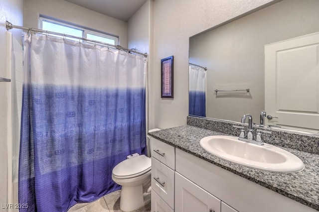 full bathroom with shower / bath combination with curtain, tile patterned floors, vanity, and toilet