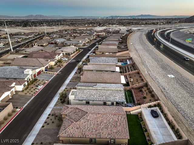 birds eye view of property featuring a mountain view