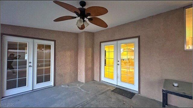 property entrance featuring ceiling fan, a patio, and french doors