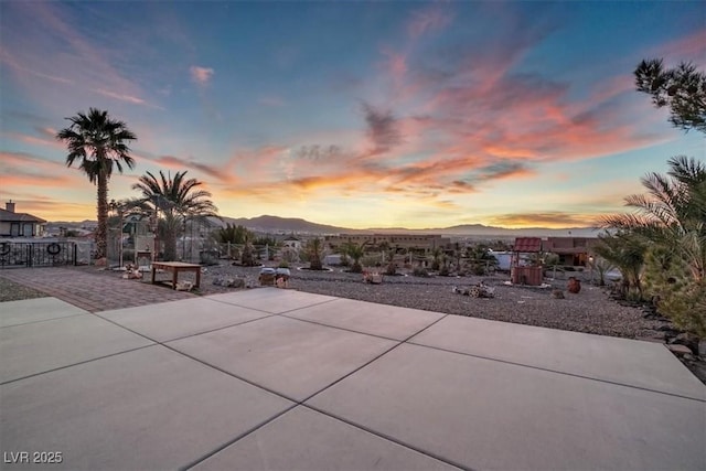 patio terrace at dusk with a mountain view