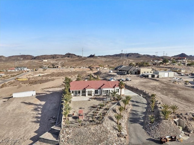 birds eye view of property with a mountain view