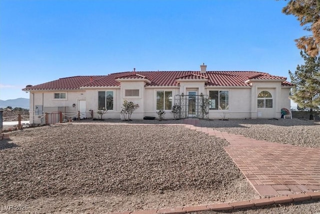 back of house with a mountain view