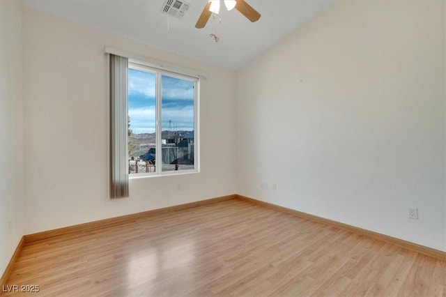 unfurnished room with ceiling fan, lofted ceiling, and light hardwood / wood-style flooring