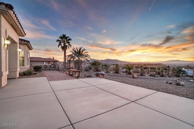 patio terrace at dusk with a mountain view