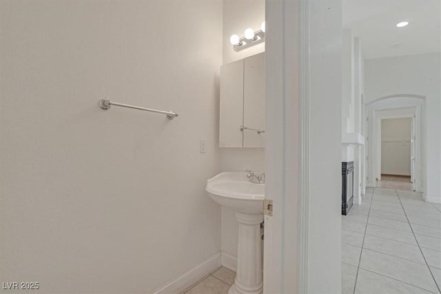 bathroom with tile patterned flooring and sink