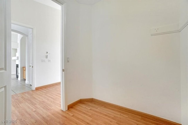 spare room featuring light wood-type flooring