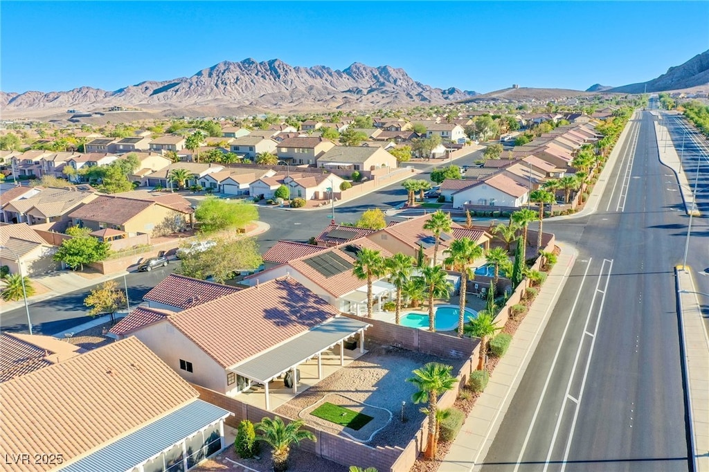 birds eye view of property featuring a mountain view