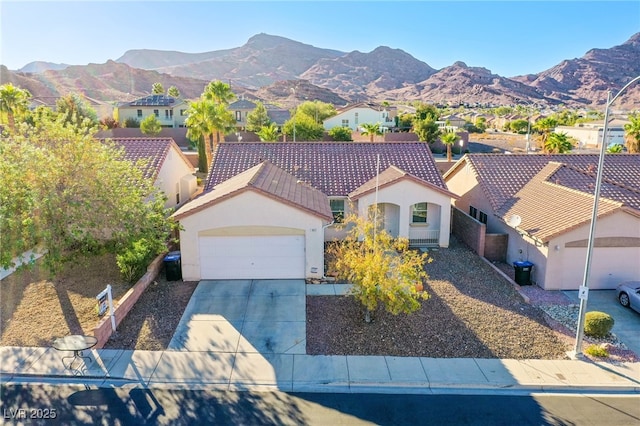 view of front of property with a mountain view, a garage, and central air condition unit