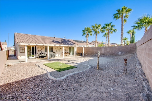 back of house featuring a patio area