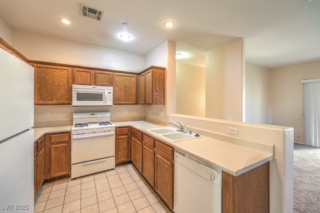 kitchen featuring kitchen peninsula, sink, light tile patterned flooring, and white appliances