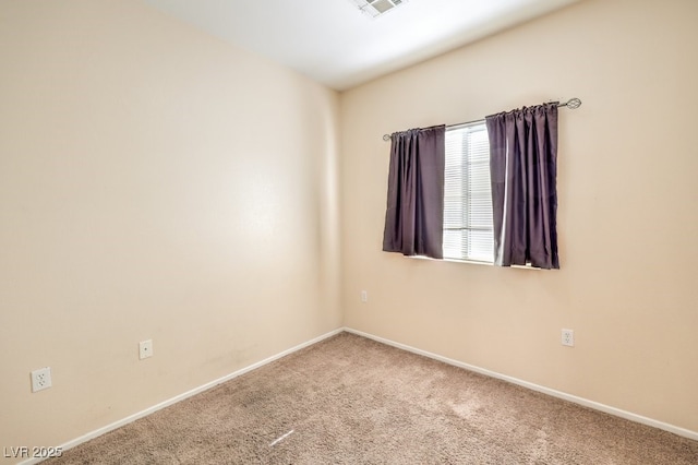 unfurnished room featuring carpet