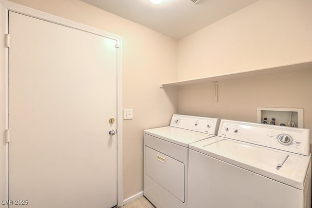 clothes washing area with independent washer and dryer