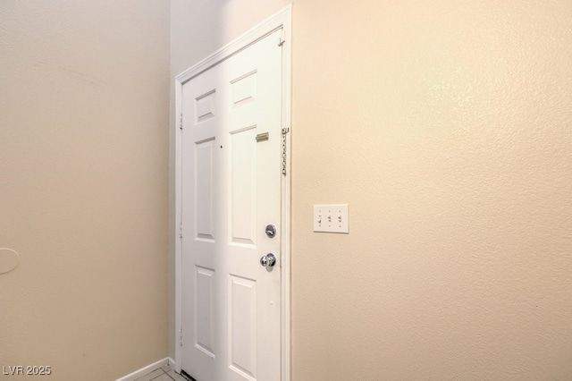 doorway featuring tile patterned floors