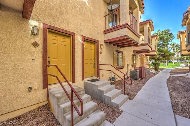 doorway to property with central air condition unit