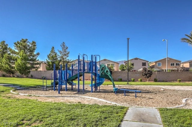 view of jungle gym featuring a lawn