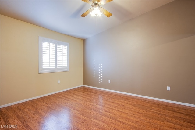 empty room with wood-type flooring and ceiling fan