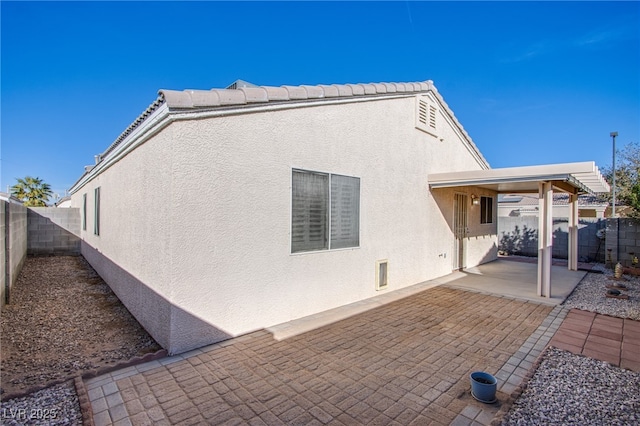 rear view of property with a patio area