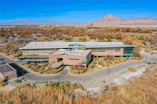 birds eye view of property with a mountain view