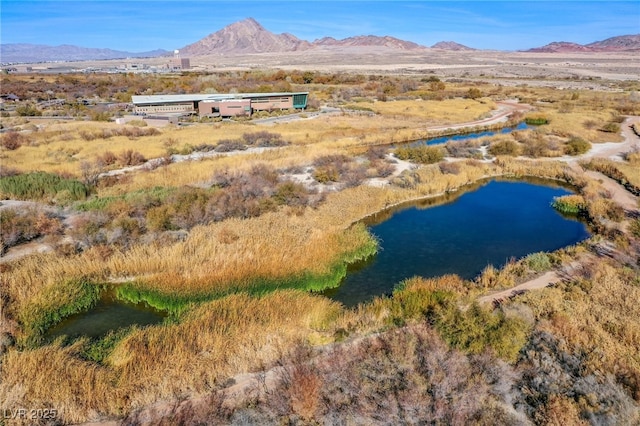 bird's eye view with a water and mountain view