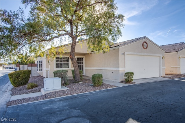 ranch-style home with a garage