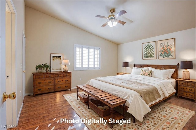 bedroom featuring vaulted ceiling, ceiling fan, and dark hardwood / wood-style flooring