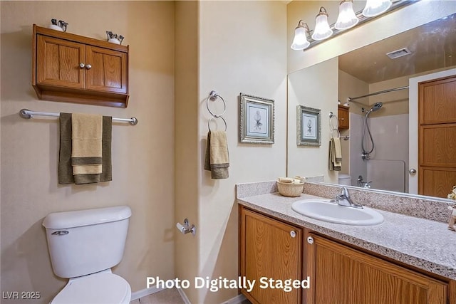 bathroom with walk in shower, vanity, and toilet