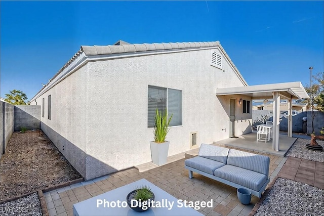 rear view of house with a patio