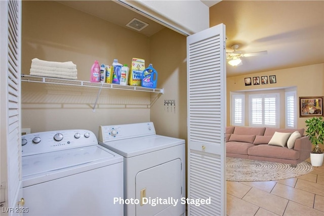 laundry room featuring ceiling fan, washer and dryer, and light tile patterned floors