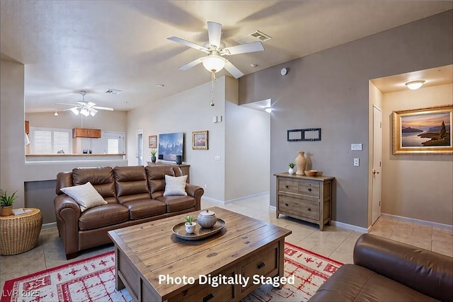 tiled living room with lofted ceiling and ceiling fan