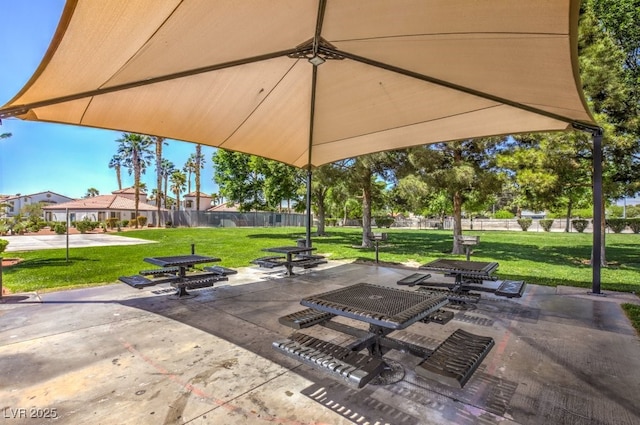 surrounding community featuring a yard and a patio