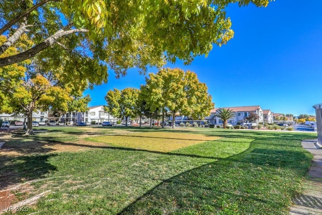 surrounding community featuring a lawn