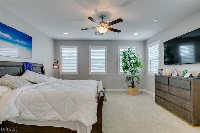 bedroom with ceiling fan and light colored carpet