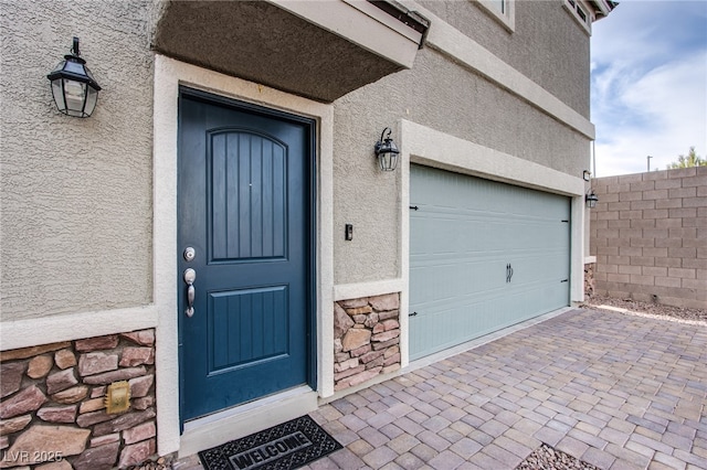 entrance to property featuring a garage