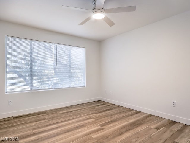 unfurnished room featuring light hardwood / wood-style floors and ceiling fan