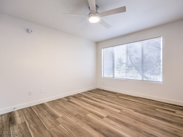 unfurnished room with ceiling fan and light hardwood / wood-style floors