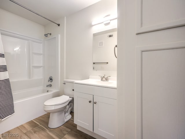 full bathroom featuring hardwood / wood-style floors, vanity, toilet, and shower / tub combo with curtain