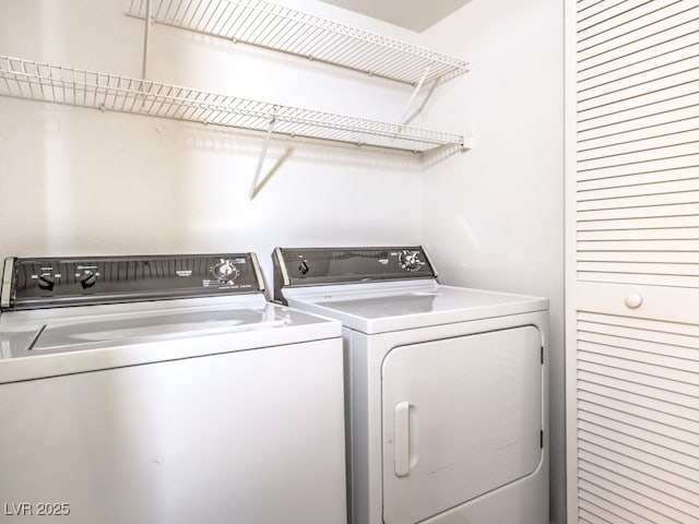 laundry area with separate washer and dryer